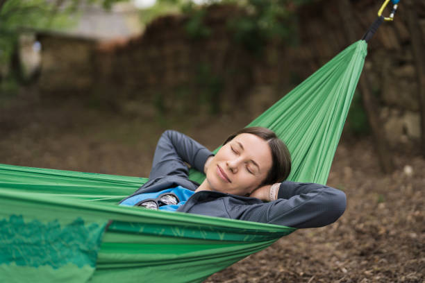 istock Smiling woman resting in a hammock 1460623259