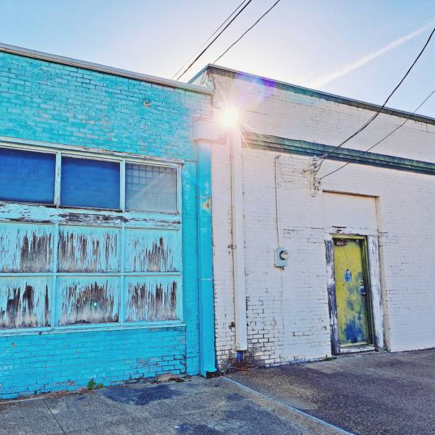 istock Sunburst through Gutter Hole in Urban Back Street Scene 1460623386