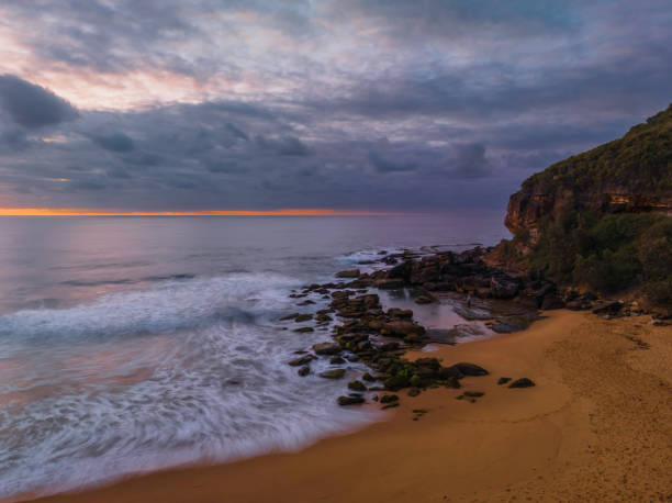 istock Soft sunrise seascape with clouds and colour on the horizon 1460625584