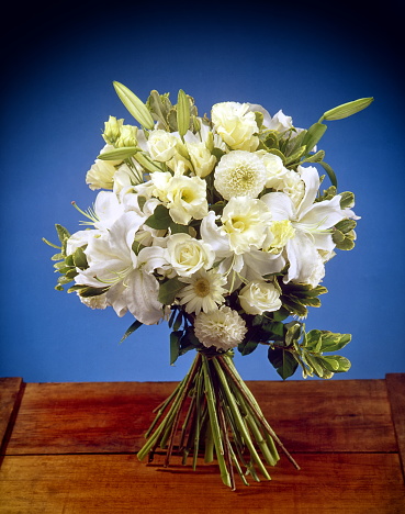 bouquet of white flowers on blue background