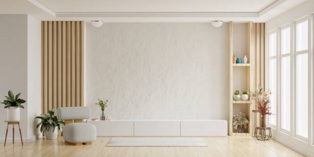 maqueta de un gabinete de tv de pared montado con sillón en sala de estar con una pared de cemento blanco. - wide house luxury residential structure fotografías e imágenes de stock