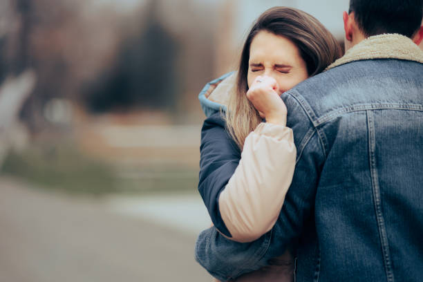 Sad Woman Crying Saying Goodbye to her Loved One stock photo