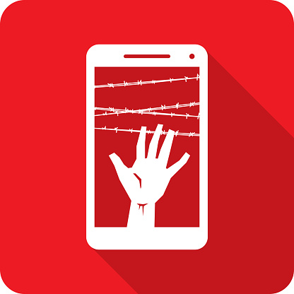Vector illustration of a smartphone with hand reaching up behind barbed wire against a red background in flat style.