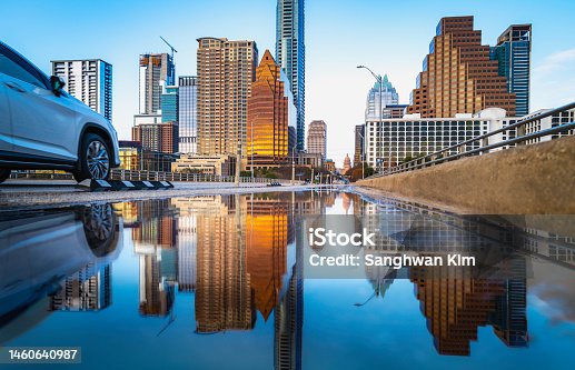 istock Vibrant Austin Texas city skyline and modern buildings reflected on the rainwater over the Congress Avenue Bridge 1460640987