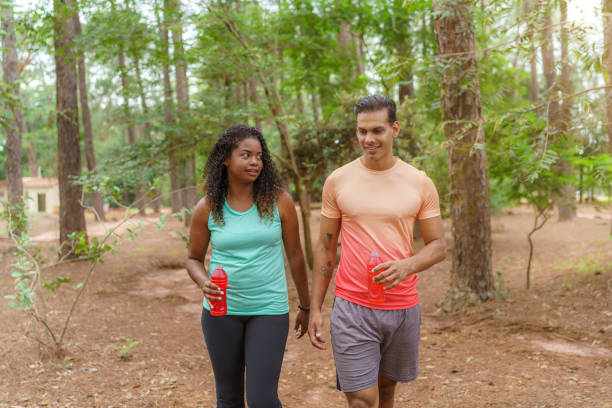 istock Friends hiking and hydrating with isotonic 1460645236