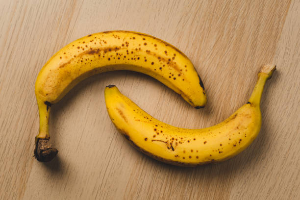 istock two ripe bananas on wooden table 1460646846