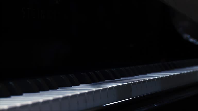 Male Hand Opening Piano Lid or Piano Fallboard. Close Up. 4K Resolution.