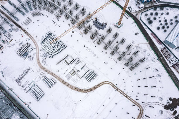 istock building site covered by snow. construction background. aerial top view in winter. 1460653625