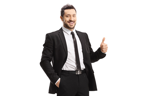 Young smiling businessman showing thumbs up isolated on white background