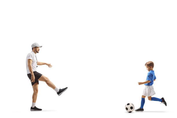 istock Coach playing football with a boy 1460655138