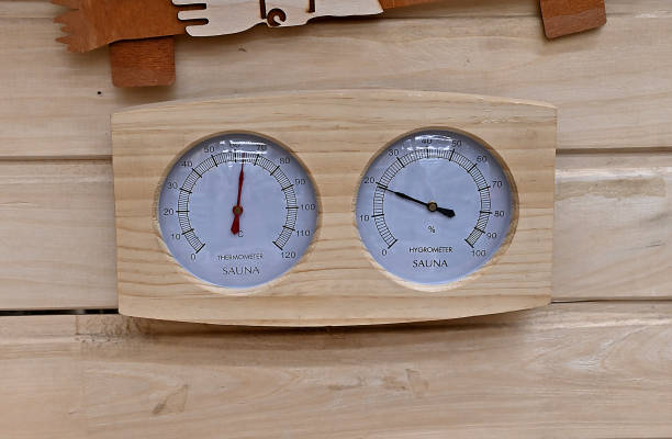 Sauna thermometer made of wood isolated on white background