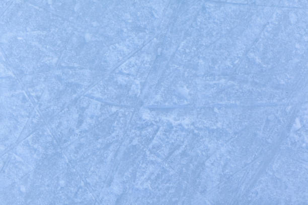 istock Empty ice rink with skate marks after the session outdoor. 1460656399