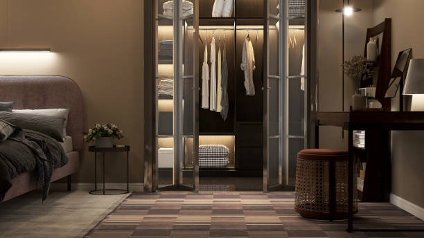 Luxury, modern design of walk in closet with stainless frame, wooden wardrobe in dark brown interior design bedroom with bed, desk, book shelf, floor lamp on carpet floor Luxury, modern design of walk in closet with stainless frame, wooden wardrobe in dark brown interior design bedroom with bed, desk, book shelf, floor lamp on carpet floor for decoration background 3D walk in closet stock pictures, royalty-free photos & images