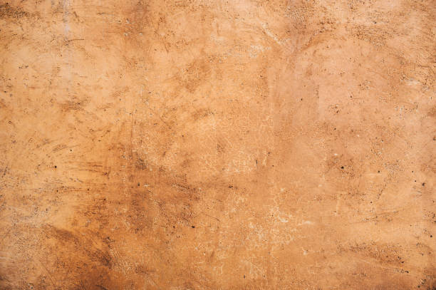 istock Full frame shot of an earthen wall texture of clay house structure. 1460659259