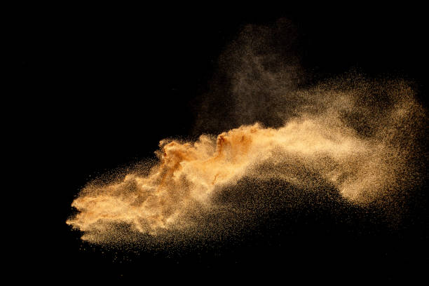 istock Sand explosion isolated on black background. Freeze motion of sandy dust splash. 1460661039
