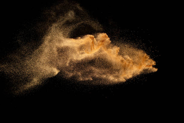 istock Sand explosion isolated on black background. Freeze motion of sandy dust splash. 1460661042