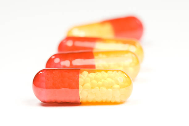 Red and yellow pills stock photo