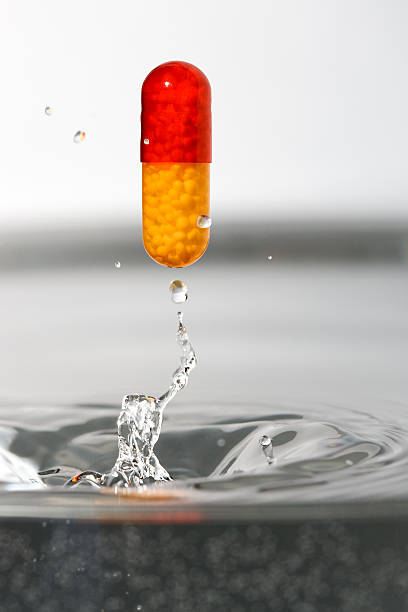 Medication and splash of water stock photo