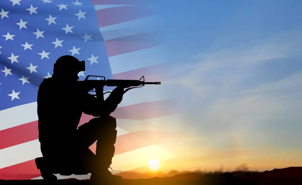 istock Silhouette of army soldier with USA flag 1460666833
