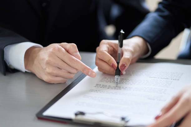 istock Asian business person confirming contract details 1460666840
