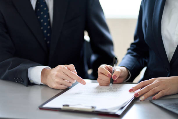 istock Asian business person confirming contract details 1460666854