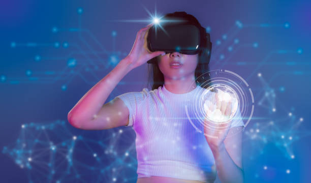 istock Metaverse technology. Young asian woman wearing vr headset, watching, playing, touching virtual reality world. 1460668165