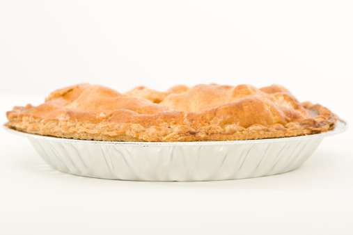 Side view of an old-fashioned golden apple pie.