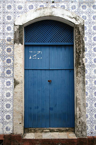 Tiled Door An old door surrounded by tiles in Sao Luis, Brazil. sao luis stock pictures, royalty-free photos & images