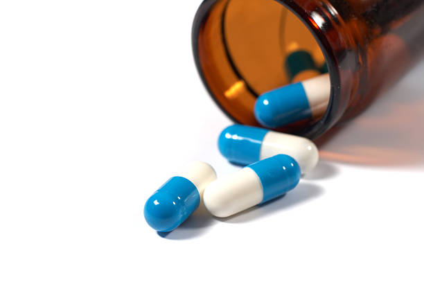 istock Tablets dropped out of a bottle 146067217