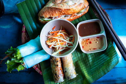 You can find very popular Vietnamese cuisines in one plate. \nI had lunch at a Hidden Gem Bar while in Hanoi and they serve very lovely plates. You have fresh spring rolls, deep fried spring rolls and Bánh mì (Sandwich). They all are quite popular. You must have tasted them.