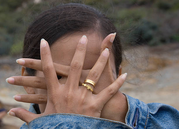 istock Young woman hiding her face 146067535