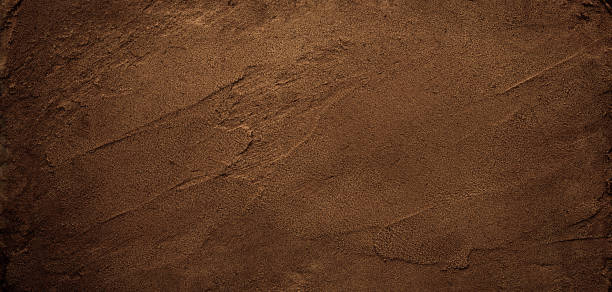Dark chocolate brown sugar-like grainy texture background