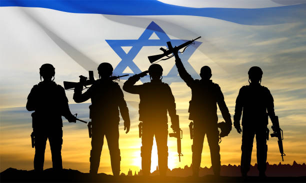 istock Silhouettes of soldiers with Israel flag 1460678352