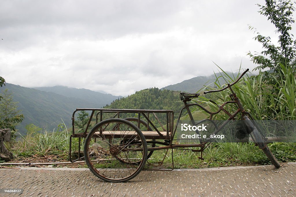 Side of the Road Bike parked on the side of the road in Longsheng, China. Bicycle Stock Photo