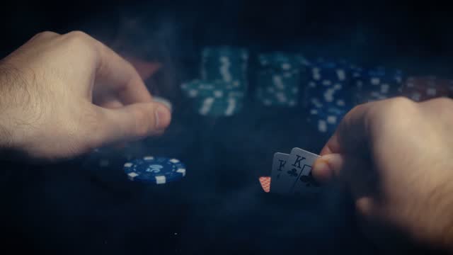 The player watches art while playing poker. A combination of four aces, four of a kind, winning cards fell out. Slow motion.