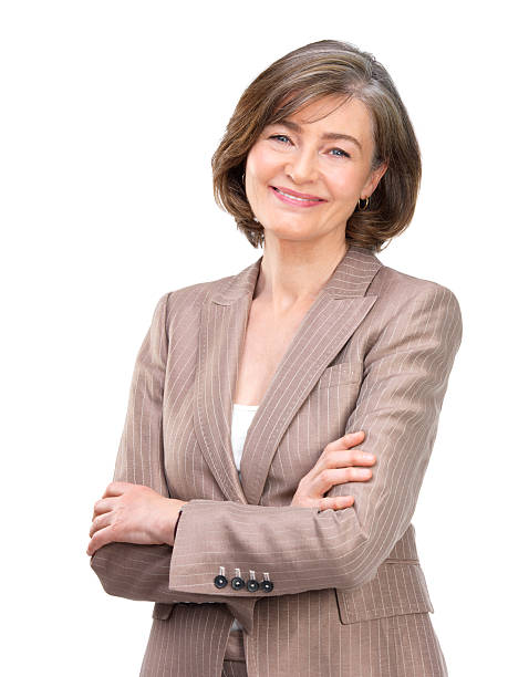 close-up of деловая женщина улыбается с скрестив руки на белом фоне - determination isolated on white vertical looking at camera стоковые фото и изображения