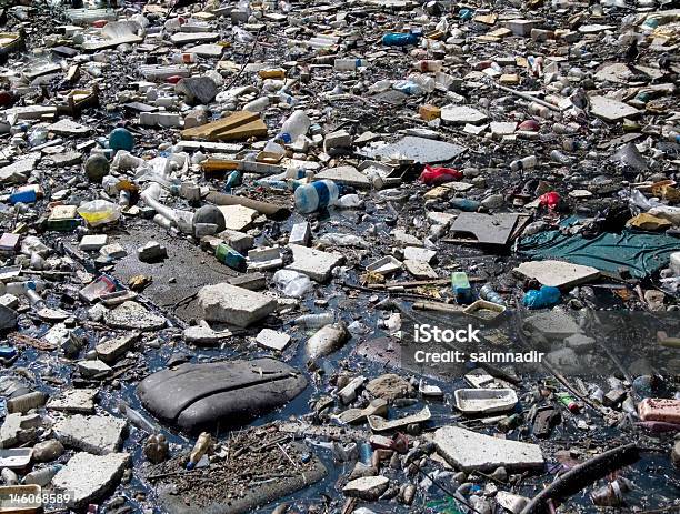 Garbage Puddle Stock Photo - Download Image Now - Backgrounds, Bag, Buried