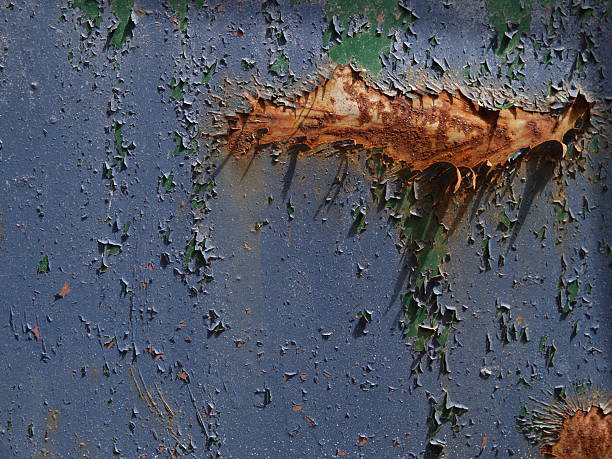 peeling paint on rusted metal surface stock photo