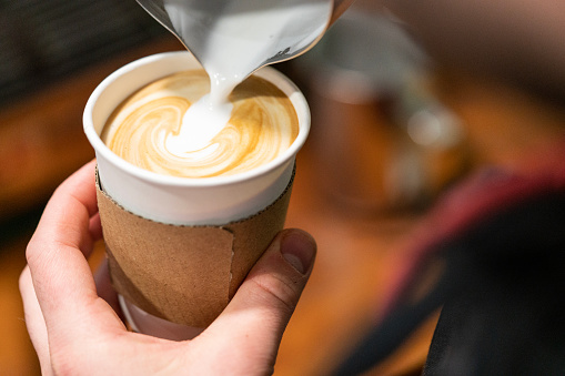 Barista make coffee cup latte art