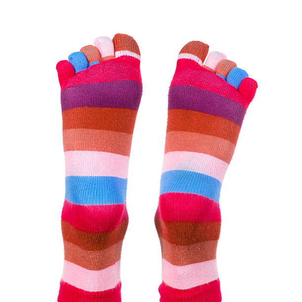 istock feet with colorful striped socks 146069694
