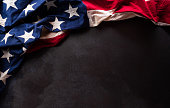 istock Happy Presidents day concept made from American flag  on dark stone background. 1460698040