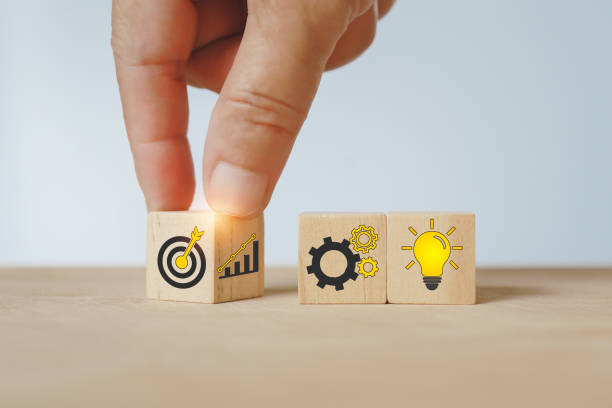 istock For business strategy concept. hand flipped wooden cube block, increasing graph to dartboard icon 1460702149