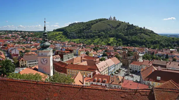 Mikulov aerial view from Mikulov Castle, famous clocktower and limestone hill with chapel, popular touristic guided tour destination, Mikulov, Moravia, Czech Republic