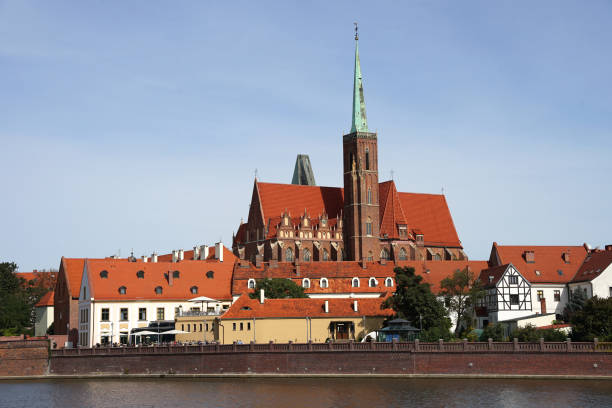 istock Wroclaw Church of the Holy Cross behind Oder River view, popular tourist destination, guided tour concept 1460703935