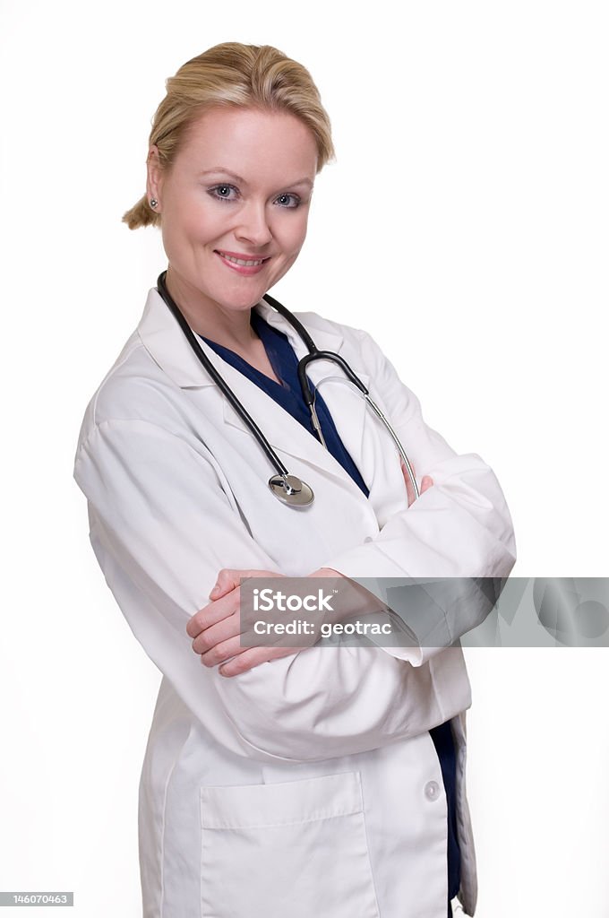 Attractive lady doctor Attractive blond woman doctor wearing scrubs and white lab coat with stethoscope smiling on white 30-39 Years Stock Photo
