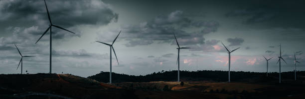 istock Panoramic View Of Windmills On Landscape Against Sky 1460705304