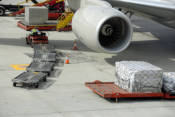An aircraft waiting to load cargo stock photo