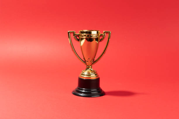 istock toy throphy on red background 1460708009