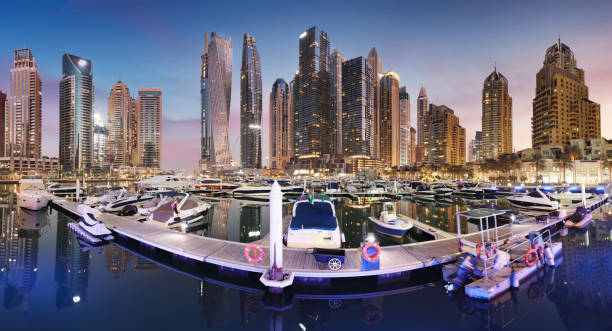 istock Dubai Marina panorama at night with luxury yacht, UAE 1460709077