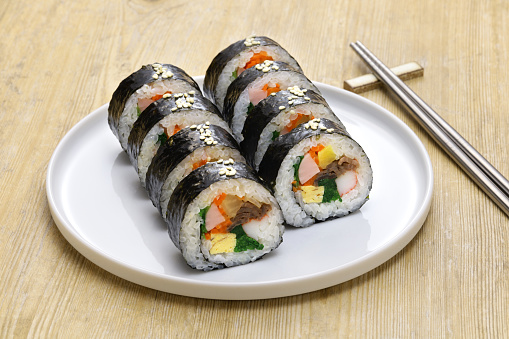 Gimbap is a Korean food consisting of rice and several ingredients seasoned with sesame oil and wrapped in nori seaweed.